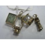 9ct Gold Novelty Charm Pendants, a lighthouse, wishing well, oil lamp, Emergency One Pound note. (