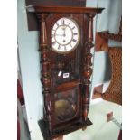 A XIX Century Walnut Cased Viennese Wall Clock, having subsidiary seconds dial to white enamel