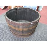 A Large Garden Planter, in the form of a coopered half barrel, 65cm diameter