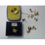A Pair of 9ct Gold Earstuds, of flower head design, another similar pair, a pair of plain ball