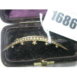 A Victorian Crescent Moon and Stars Bar Brooch, with graduated seed pearl highlights, engraved
