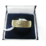 A 9ct Gold Large Patterned Band Ring, allover Grecian design.
