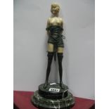 A Reproduction Art Deco Style Bronze Effect and Resin Model of a Female with Whip, on stepped oval