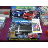 A Modern Scalextric 1:32nd Scale Audi TT Slot Racing Set, including red and blue Audi TT cars,