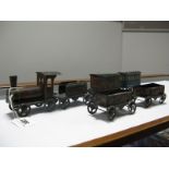 An Early XX Century Tinplate Floor Train, of German origin, comprising locomotive, tender, two