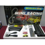 A Scalextric #C1019 Mini Racing Set (Circa 1990's), comprising of two Mini Cooper slot racing