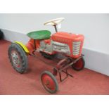 A 1960's Blown Plastic and Steel Children's Pedal Tractor, by Tri-ang, appear complete, however