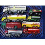 Nine Rigid Petrol Tankers, made up from Dinky and Matchbox components, all repainted.