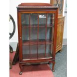 An Oak Flood Standing China Cabinet, circa 1930's having single glazed door, cabriole legs,