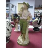 A Royal Dux Porcelain Figure of Farm Worker, holding sickle and hay sack, 28.5cm high, stamped