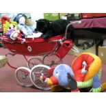 A Silver Cross Dolls Pram with Red Fabric Covering, young child's rocker, child's play black cat,