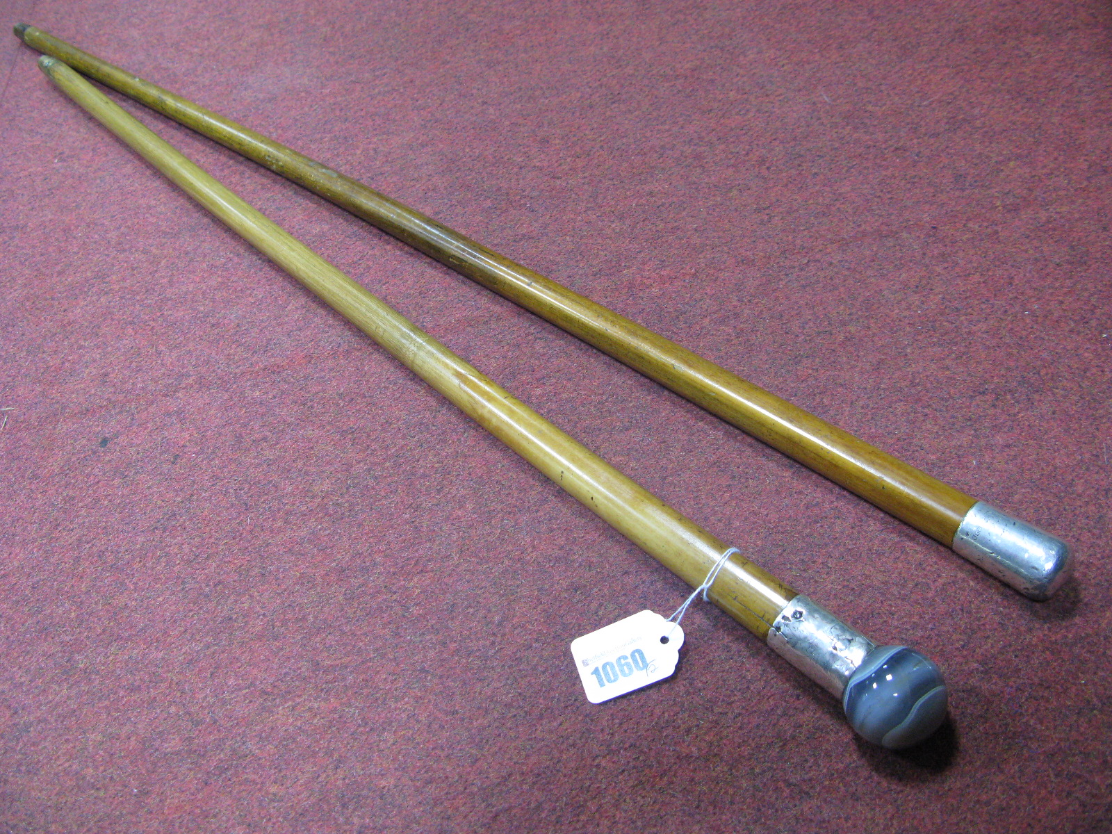 A XIX Century Malacca Cane Walking Stick, with white metal engraved mount and banded agate spherical