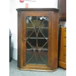 Early XIX Century Oak Corner Cupboard, with a glazed astragal door, three internal shelves.