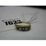 A Victorian Style Old Cut Sapphire and Diamond Ring, graduated oval collet set, stamped "18ct"