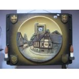 A Circa Mid XX Century Pottery Wall Plaque, featuring village scene with (later) clock to church