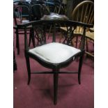 An Early XX Century Mahogany Inlaid Corner Chair, with a low top rail, shaped arms, pierced