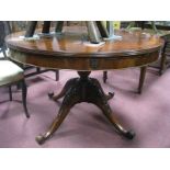 A Mahogany Pedestal Table, with a cross banded top, turned pedestal, on carved cabriole legs, scroll