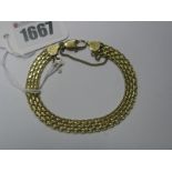 An 18ct Gold Fancy Link Bracelet, of openwork design, suspending cross charm/pendant.