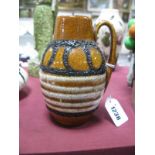 A c.1960's Small West German Fat Lava Jug Vase, the brown mottled body with lava trail and white