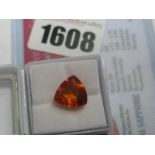 A Trillion Cut Orange Sapphire, unmounted; together with a Global Gems Lab Certificate card