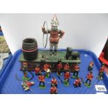 A Cast Iron Trick Dog Money Box, together with painted lead soldiers etc:- One Tray