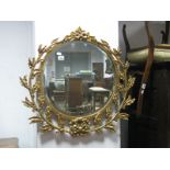 A XX Century Gilt Wall Mirror, with foliage and ribbon decoration, bevelled glass.