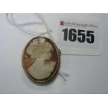 A 9ct Gold Shell Carved Cameo Brooch, depicting female profile.