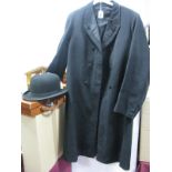 A 'Stelastic' Moores Black Bowler Hat; a black wool double breasted tail coat and a small tan