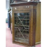 A XIX Century Mahogany Corner Cupboard, with a glazed astragal door.