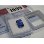 An Emerald Cut Tanzanite, unmounted; together with a Global Gems Lab Certificate card stating