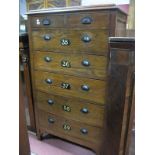 A 1930's Oak Factory/Office Chest of Two Short Drawers and Five Long Drawers, having painted metal