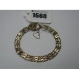 A 9ct Gold Gate Bracelet, of openwork design, to heart shape padlock clasp.