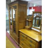 A Late XIX Century Satin Walnut Double Wardrobe with reeded and stepped pediment, twin hanging