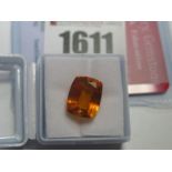 A Cushion Cut Orange Sapphire, unmounted; together with a Global Gems Lab Certificate card stating