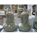 A Pair of Glazed Pottery Busts of South East Asian Deities, 43cm high.
