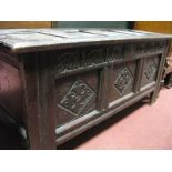 A Late XVII Century Joined Oak Blanket Box, with a four panelled top, the base with carved lozenge