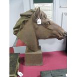 A Hollow Cast Iron Model of a Horse's Head, on square tapering plinth, 60cm high.