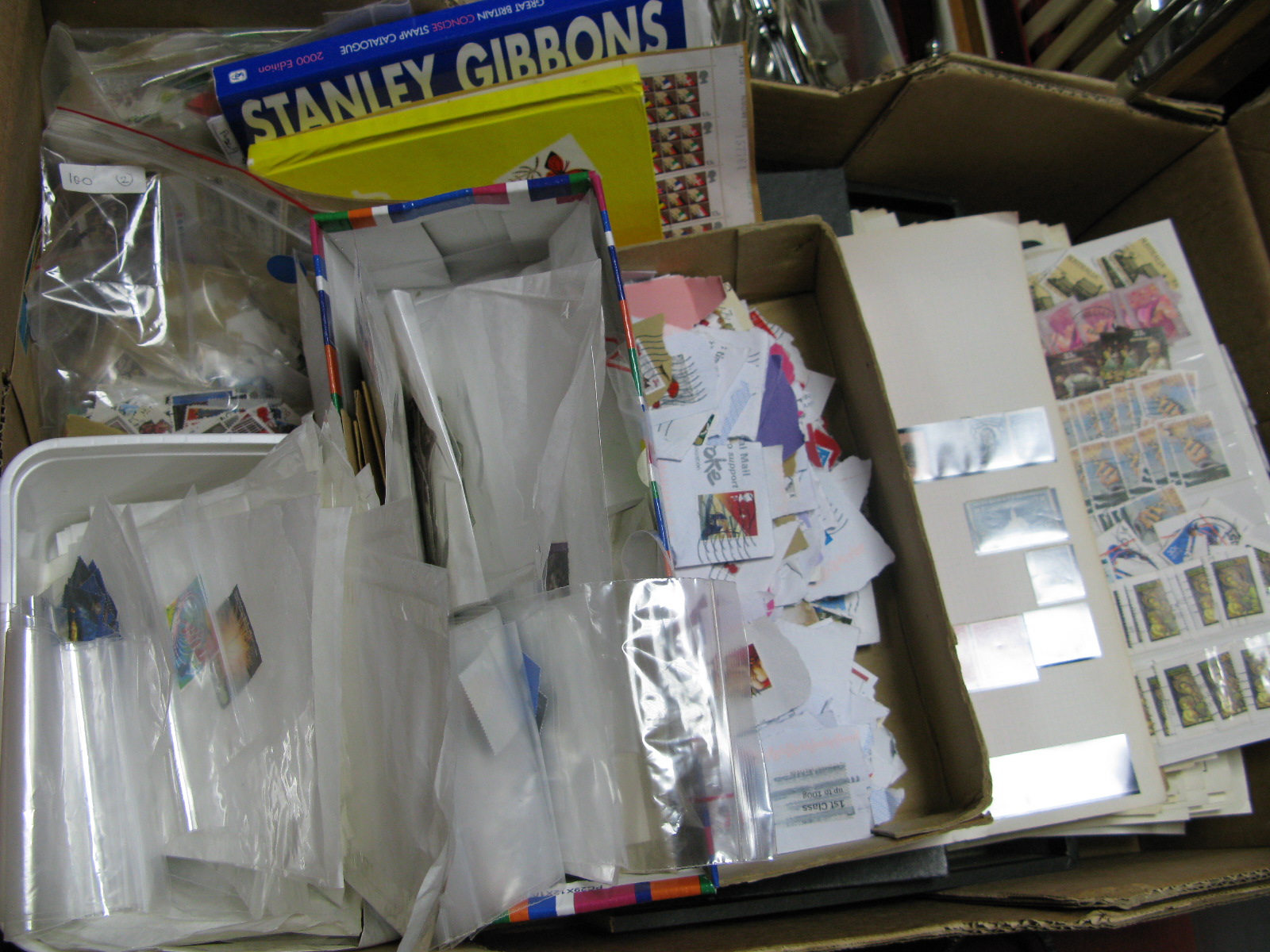 Stamps, to include large album, 100 plus packets, many loose:- One Box