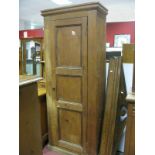 A Pine Cupboard, with a three panelled door, on a plinth base.