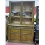 A Johnson Appleyard Sheffield Early XX Century Oak Bookcase, with a broken pediment, glazed doors,