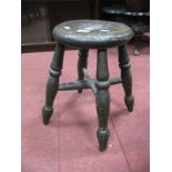 A XIX Century Ash and Elm Stool, on turned legs.