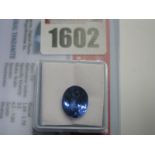 An Oval Cut Tanzanite, unmounted; together with a Global Gems Lab Certificate card stating carat
