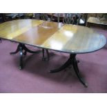 A XX Century Mahogany Twin Pedestal Dining Table, (with extra leaf), on swept legs.