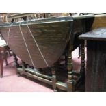 A 1920's Oak Gateleg Table, with oval top, bobbin & block supports.