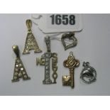 A Selection of 9ct Gold and "375" Pendants, including ornate initials, an openwork heart, a Dolphin,