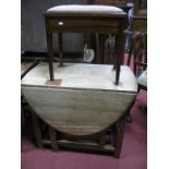 Oak Oval Topped Drop Leaf Table, piano stool containing sheet music.