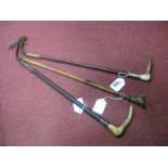 A XIX Century Cane, with a carved dogs head and movable jaw, together with two riding crops, with