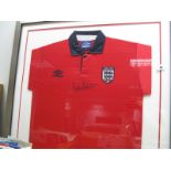 Bobby Robson, black pen autograph (unverified) on a Umbro England red away shirt, mounted glazed and