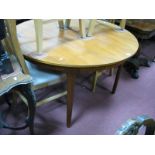 A A.H.McIntosh Teak Circular Dining Table, with concealed leaf.