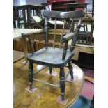 A XIX Century Elm Small Child's Spindle Back Chair, with turned arm rests and splayed legs, united